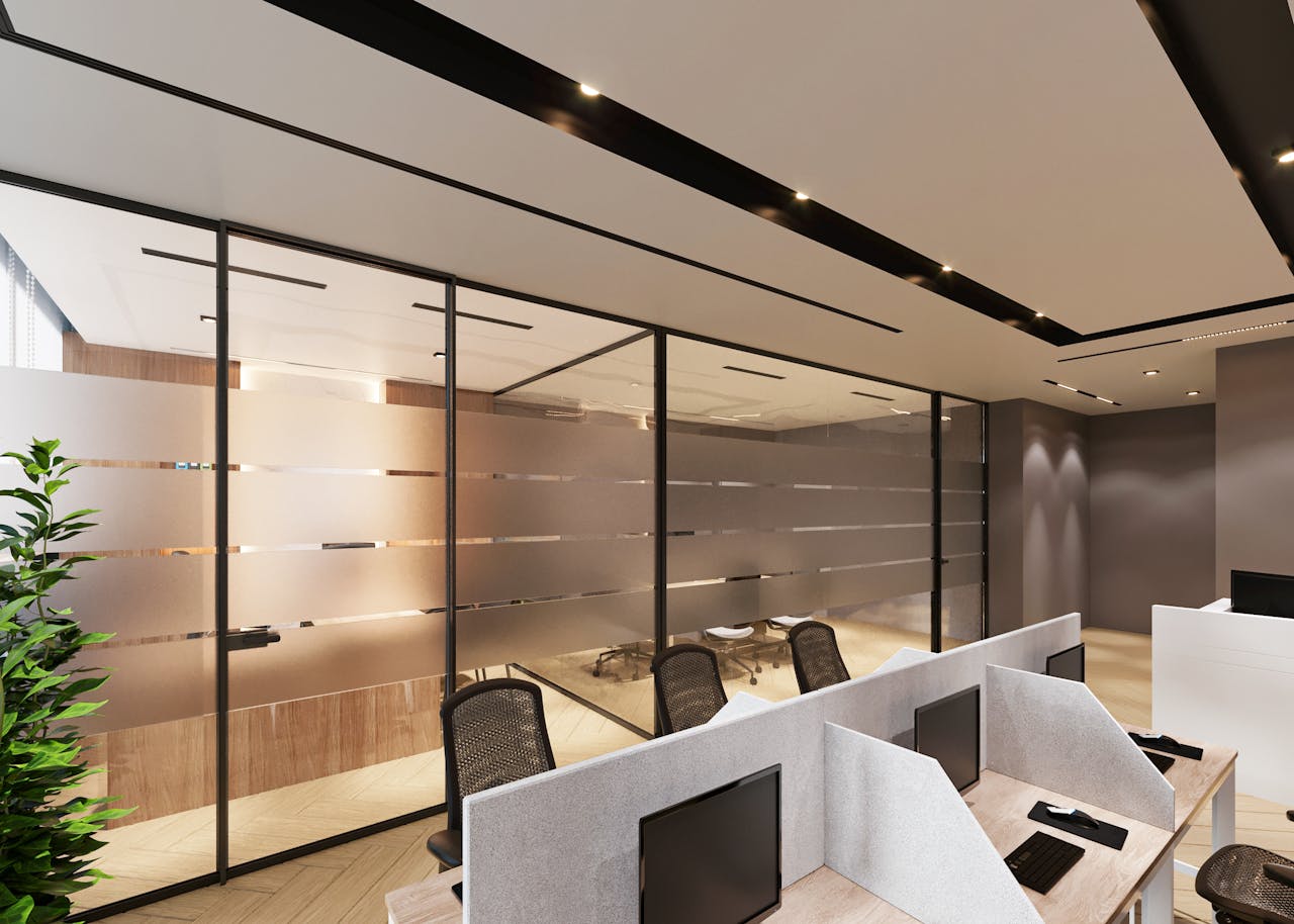 why-choose-us Contemporary office space featuring sleek cubicles and large glass partitions for an open ambiance.